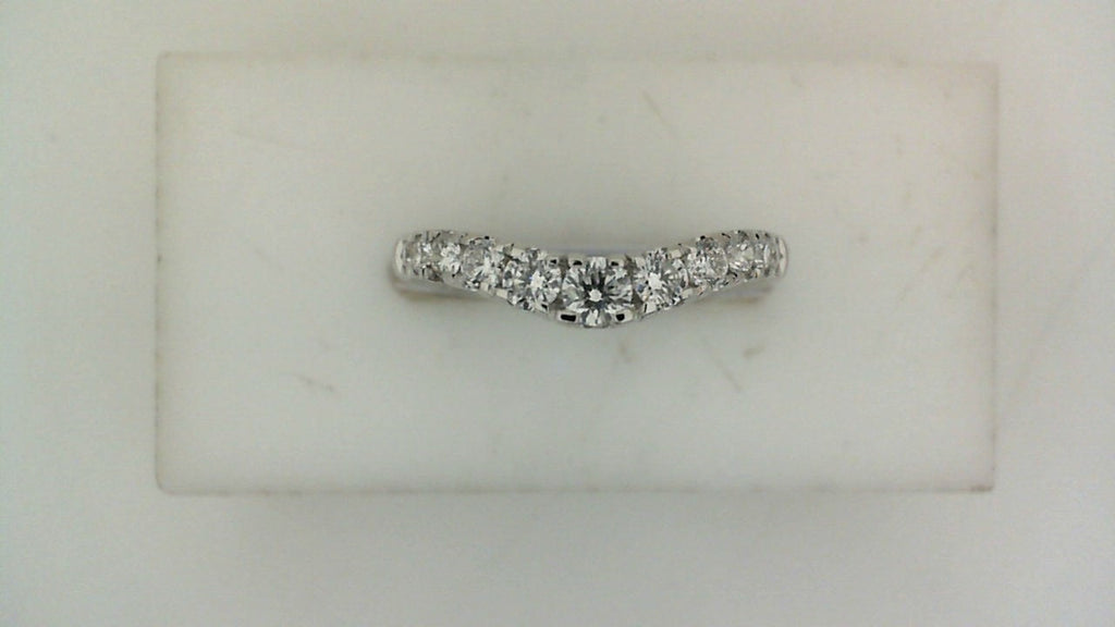 Contour wedding band with round diamonds in white gold.