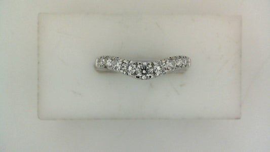 Contour wedding band with round diamonds in white gold.