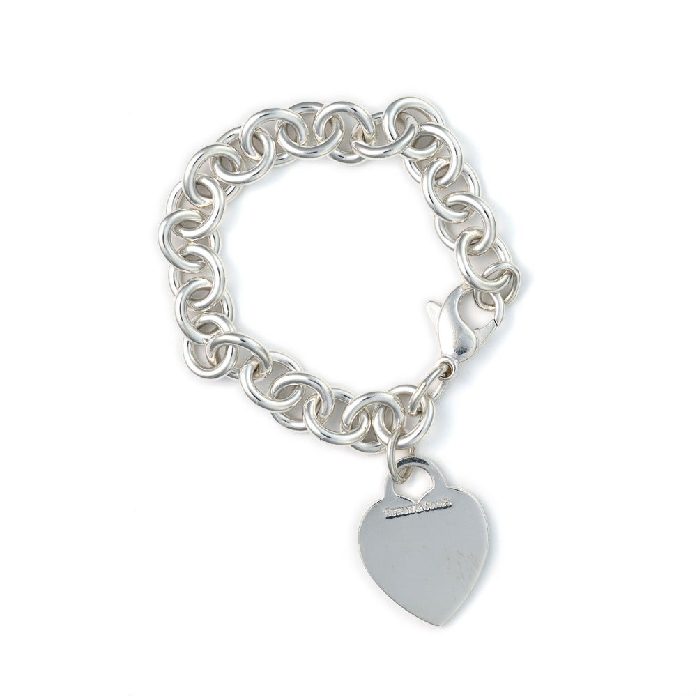 Sterling silver rolo bracelet with heart charm.