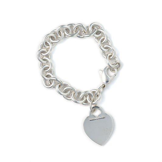 Sterling silver rolo bracelet with heart charm.