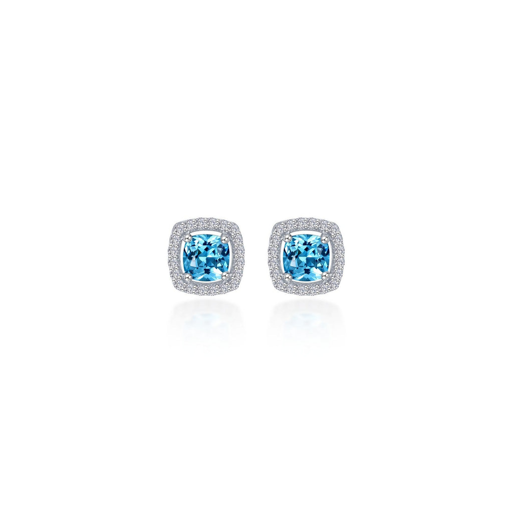 Cushion-cut blue topaz earrings with diamond halo.