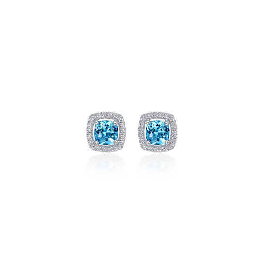 Cushion-cut blue topaz earrings with diamond halo.