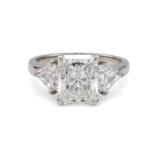Radiant diamond platinum engagement ring, three stones.