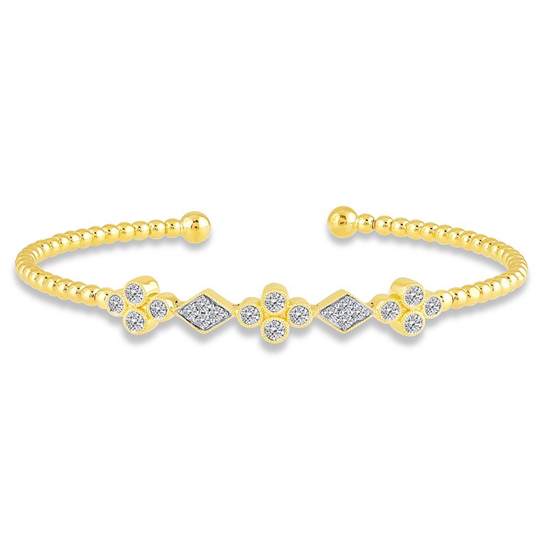 Yellow gold bangle with diamond clusters.