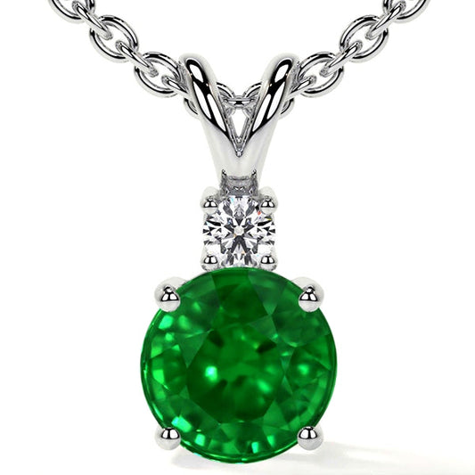 Emerald and diamond pendant on chain.