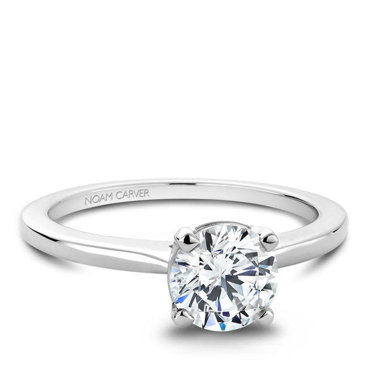 White gold ring with round diamond setting.