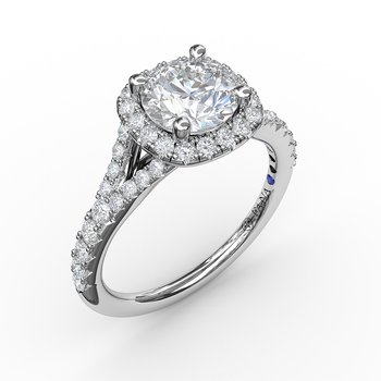 14K white gold diamond halo ring.