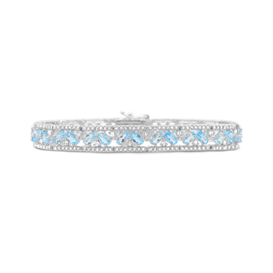 Sterling silver bracelet with blue topaz gemstones.