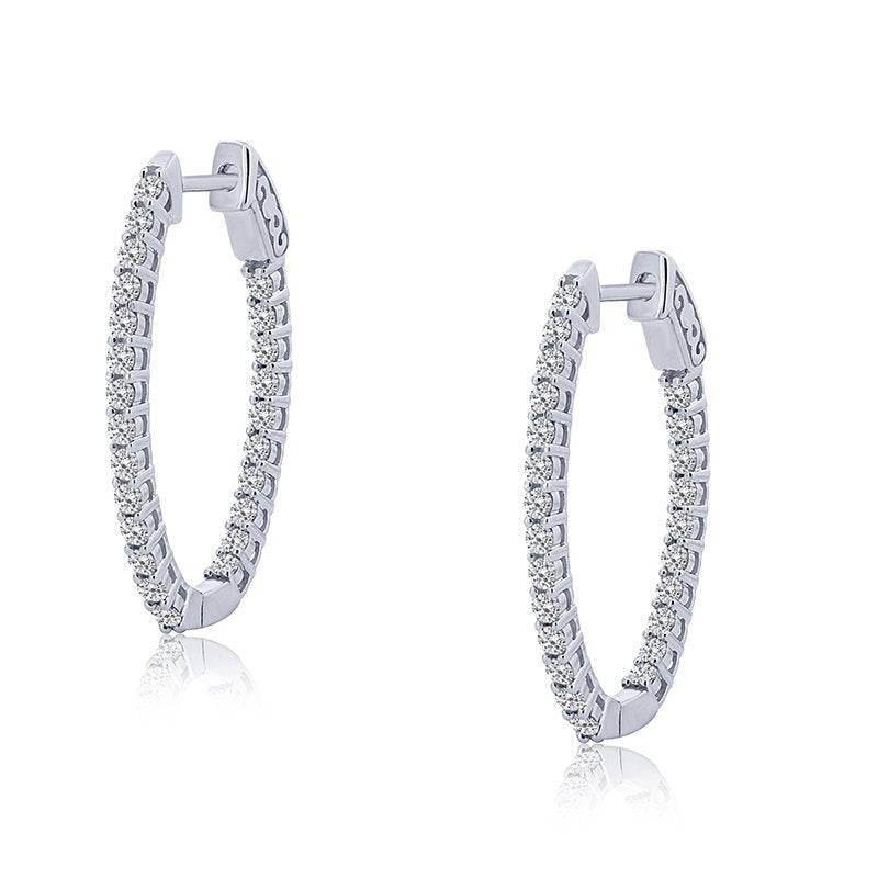 Oval white gold diamond hoop earrings.