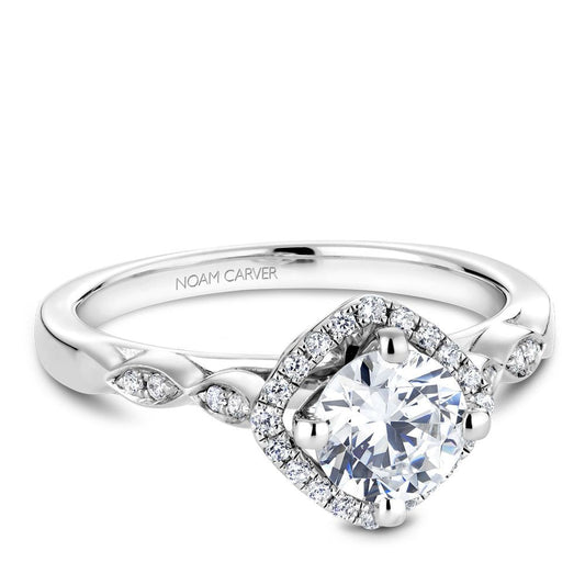 Halo diamond engagement ring with side stones.