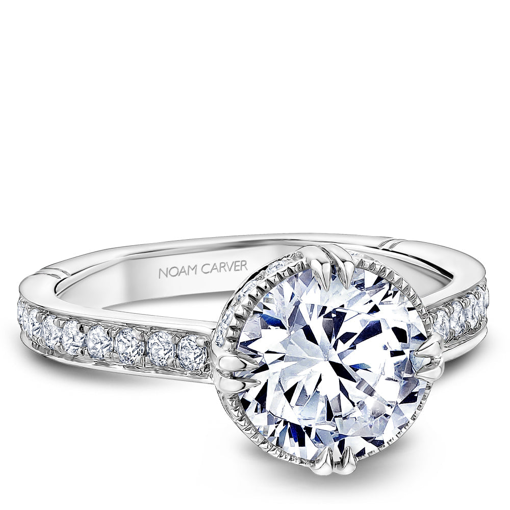 Vintage halo diamond ring in white gold.