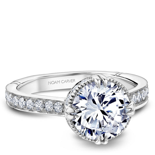 Vintage halo diamond ring in white gold.