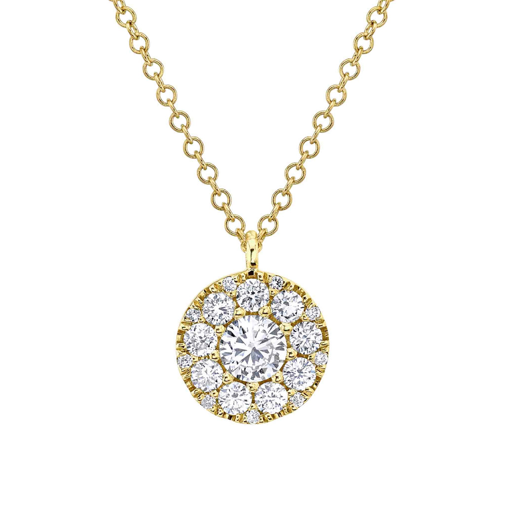 Yellow gold necklace with round diamond pendant.