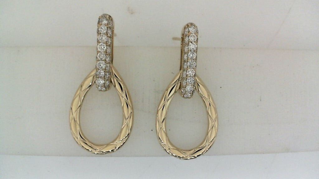Gold drop earrings with diamond accents.