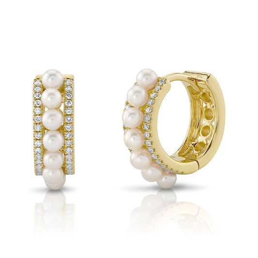 Yellow gold huggie earrings with pearls.