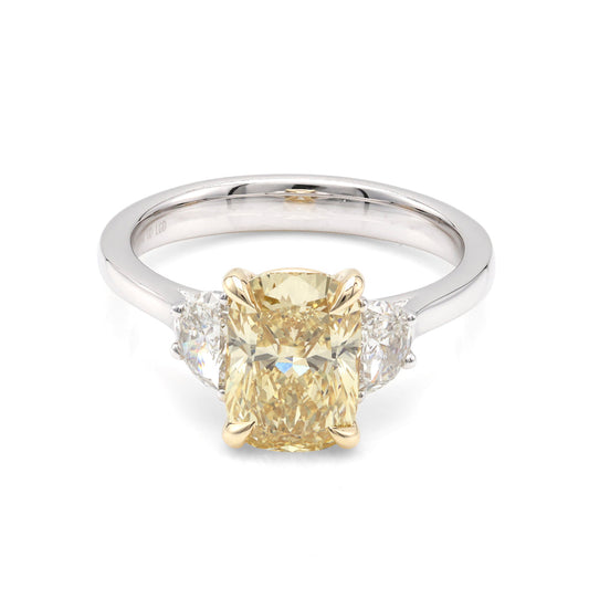 Yellow diamond three-stone engagement ring.