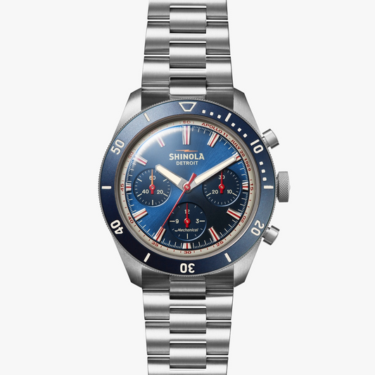 Blue dial titanium watch with sapphire crystal.