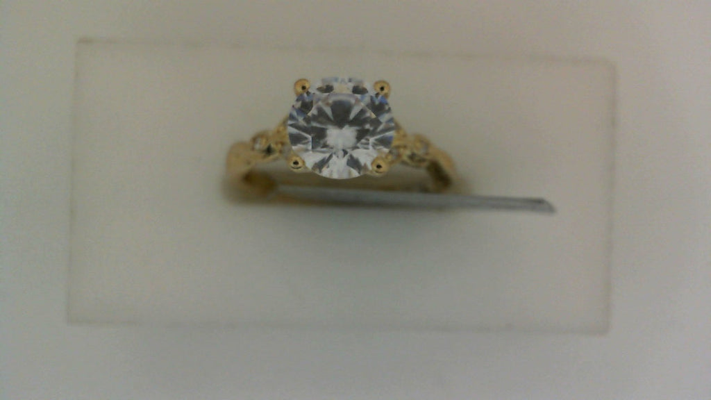 Yellow gold ring with round diamond centerpiece.