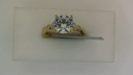Yellow gold ring with round diamond centerpiece.