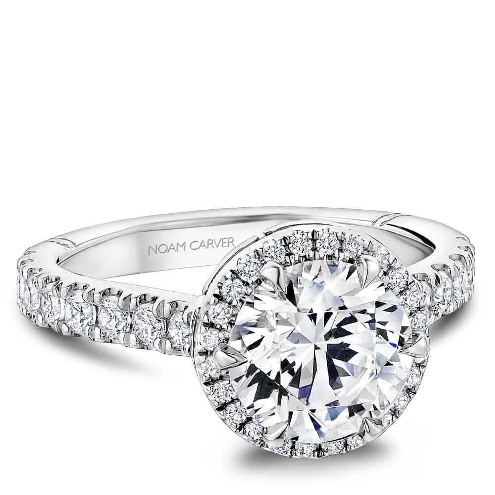 Halo diamond ring in white gold setting.