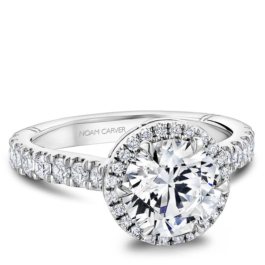 Halo diamond ring in white gold setting.