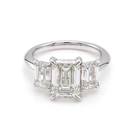 Three-stone emerald-cut diamond ring.