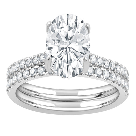Oval diamond ring with side stones.