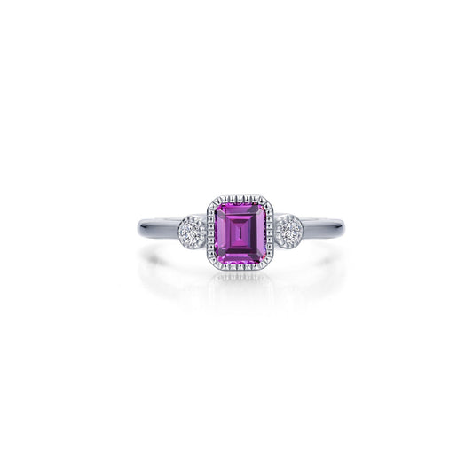 Emerald-cut Alexandrite ring with side diamonds.