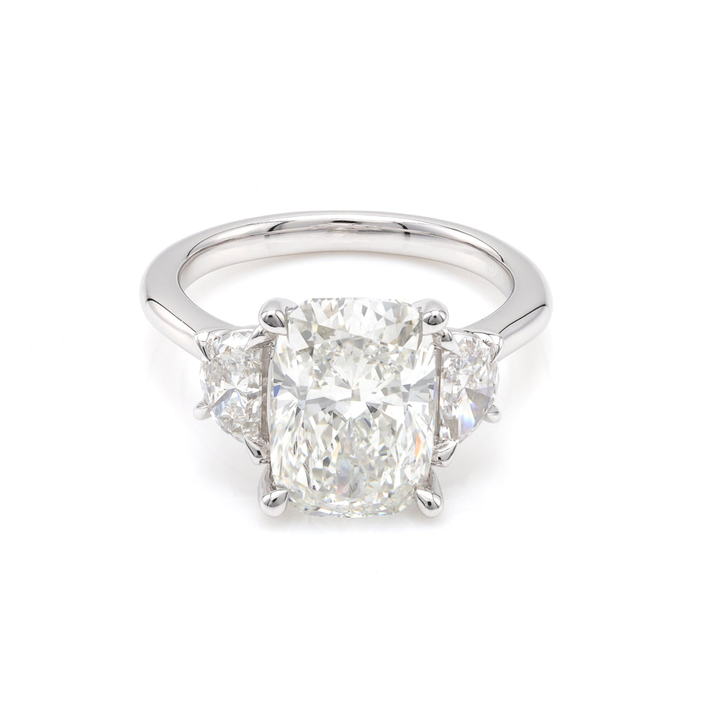 Three-stone white gold diamond engagement ring.