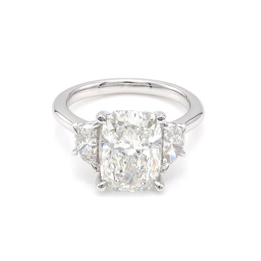 Three-stone white gold diamond engagement ring.