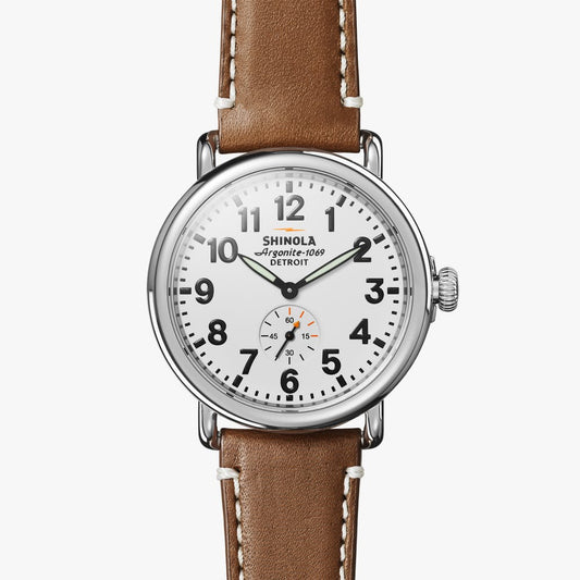 Brown leather band, white dial, stainless steel case.