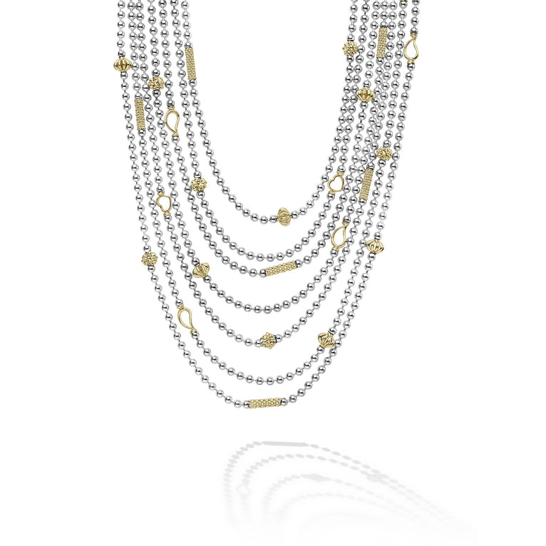 Sterling silver layered necklace with gold accents.