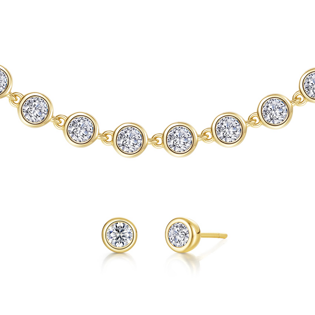 Yellow-finish simulated diamond earrings and bracelet.