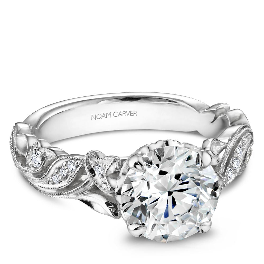 White gold ring with intricate diamond accents.