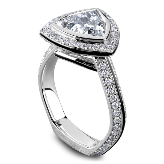 Trillion-cut diamond halo white gold ring.