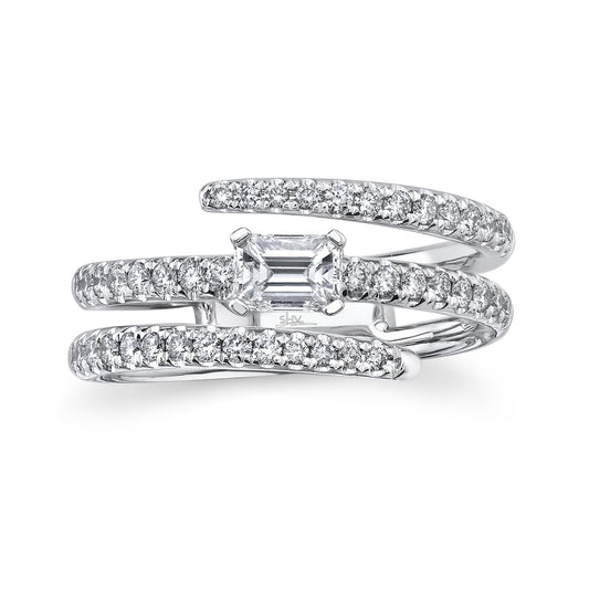White gold ring with emerald-cut diamond centerpiece.