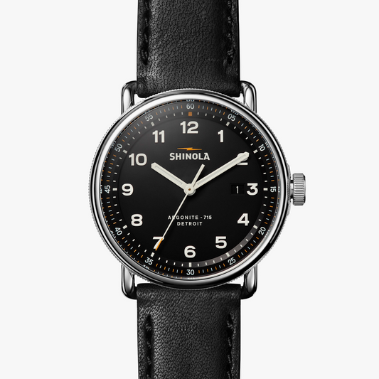 Black dial watch, stainless steel case, leather band.