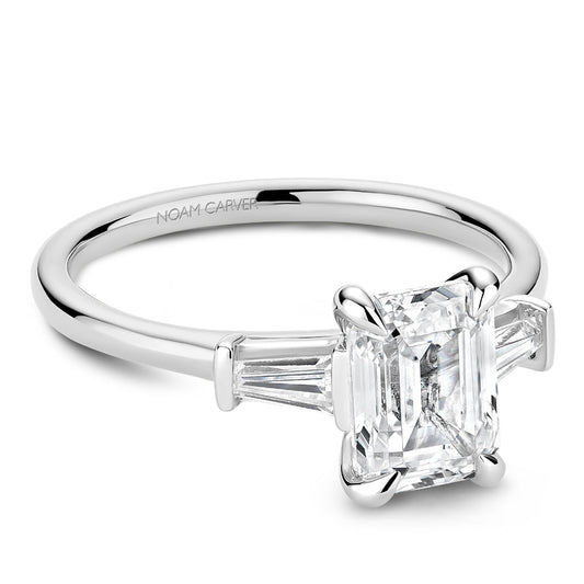 Three-stone diamond ring with baguettes.