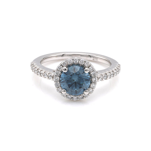 Blue diamond halo engagement ring in white gold.