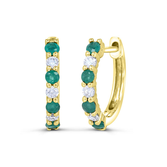 Yellow gold hoops with emeralds and diamonds.