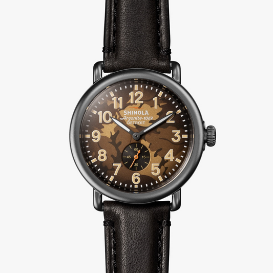 Olive camo dial, stainless steel case, leather band.