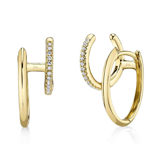 Gold huggie earrings with diamond accents.
