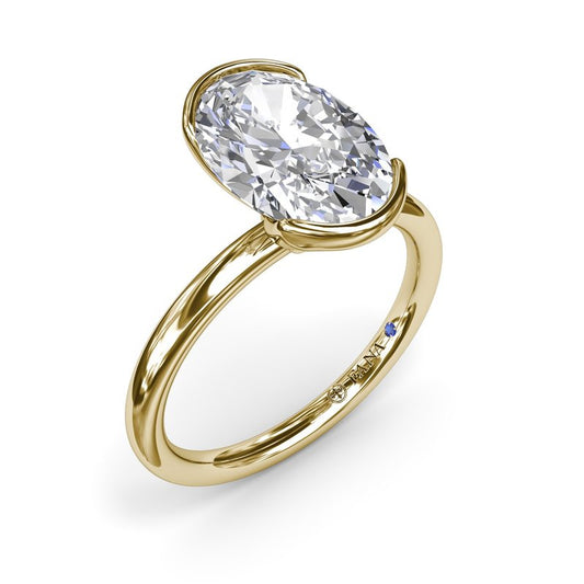 Yellow gold solitaire diamond engagement ring.