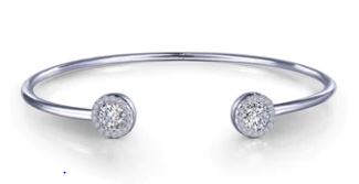 Platinum bangle with round simulated diamonds.