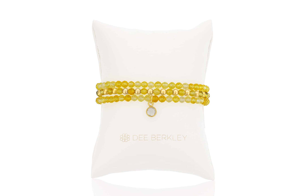 Citrine gemstone bracelet with gold accents.