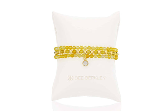 Citrine gemstone bracelet with gold accents.