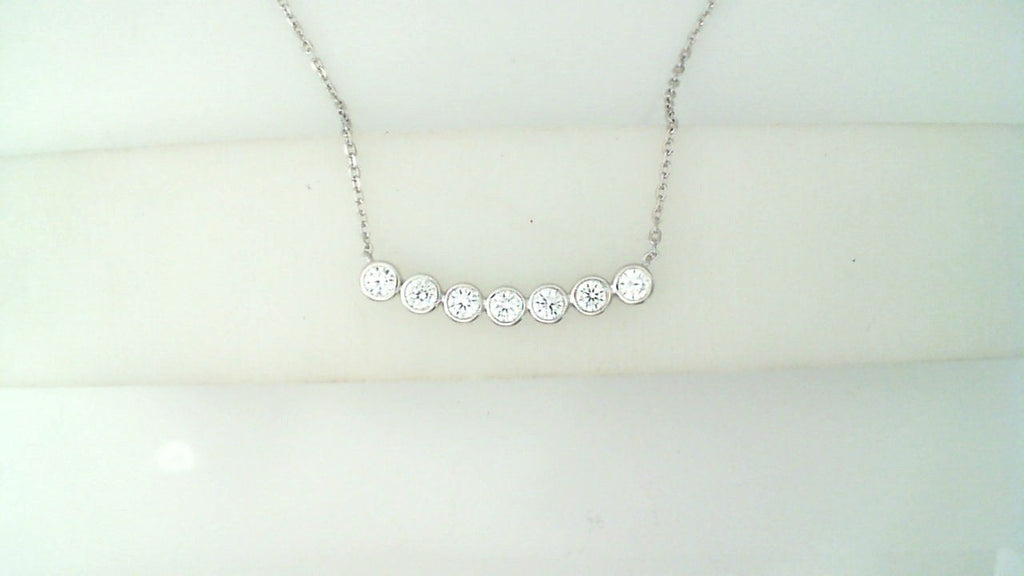Bar necklace with round simulated diamonds.