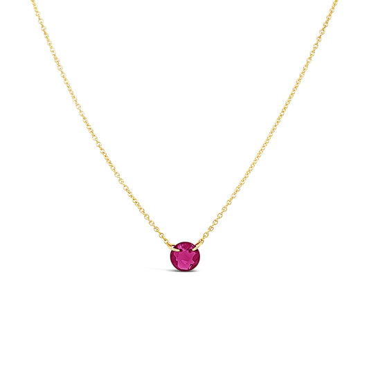 Gold-filled necklace with round ruby pendant.