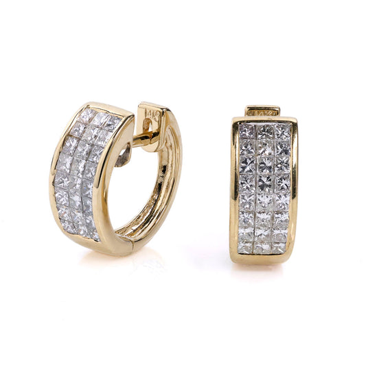 14K yellow gold huggie earrings with diamonds.