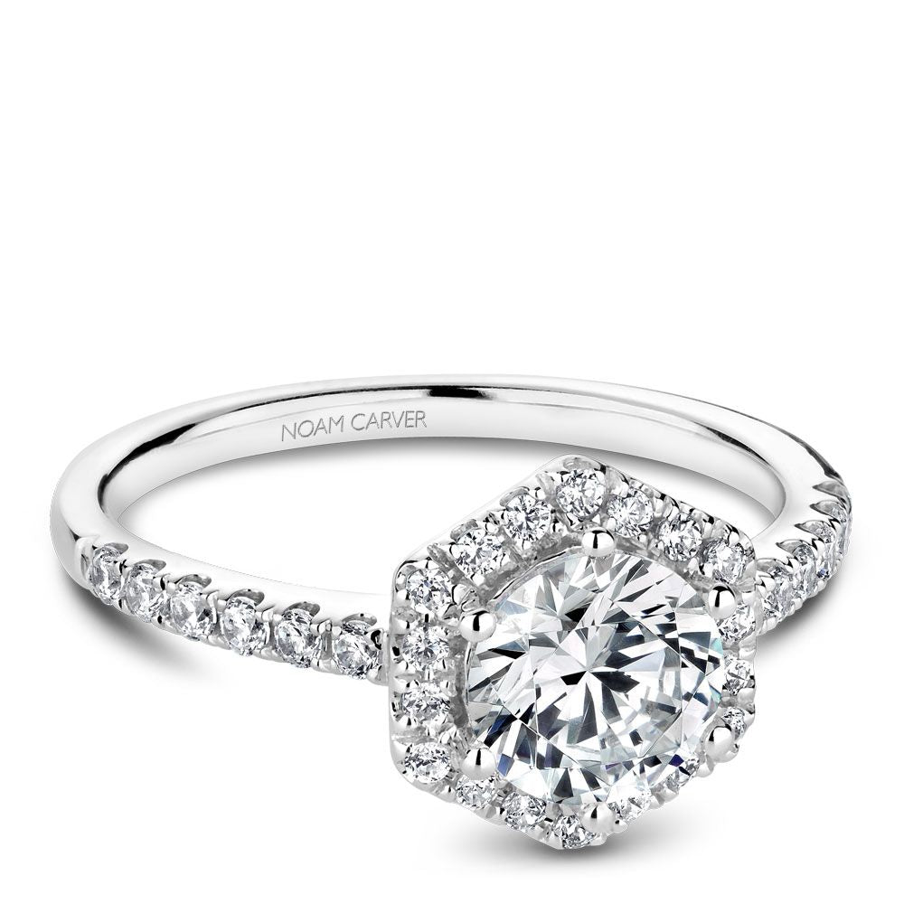 Halo diamond ring in white gold setting.